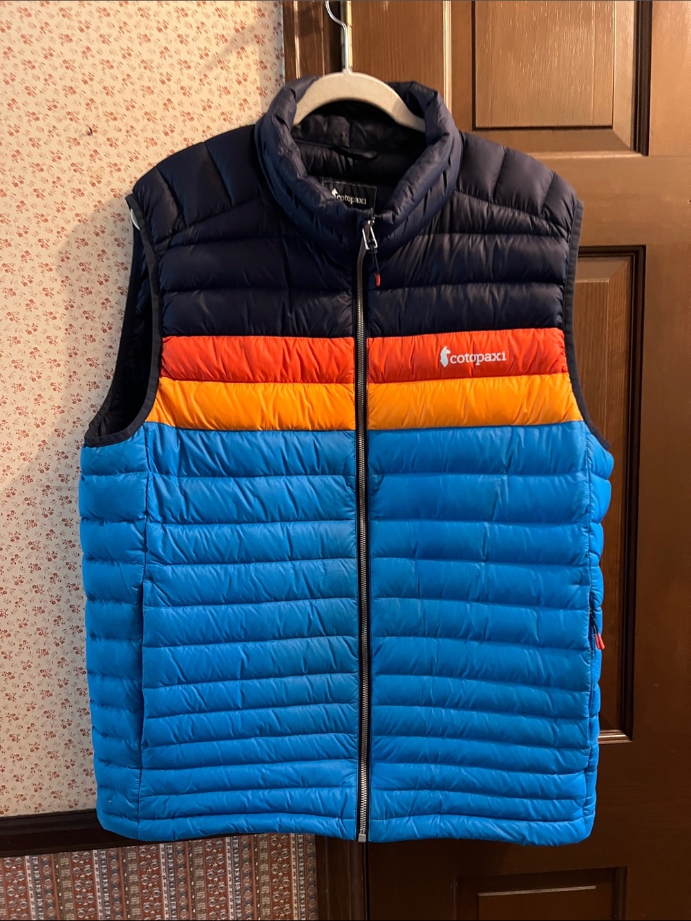 cotopaxi Blue Puffer Vest with Orange and Red Stripe